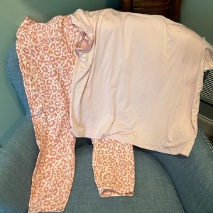 Torrid pink leopard crop yoga pants with pink off-shoulder top.